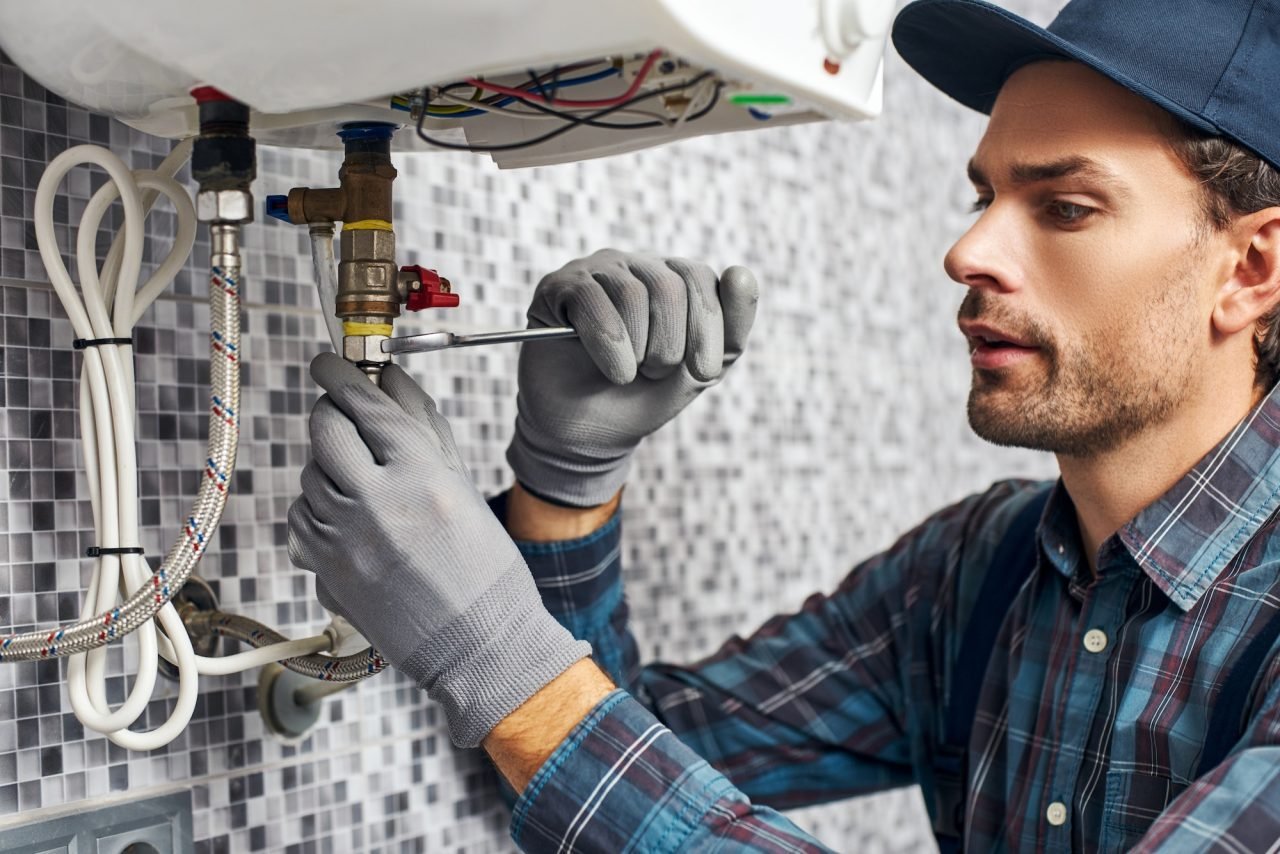Certified plumbers replacing and repairing water heaters in Jersey City